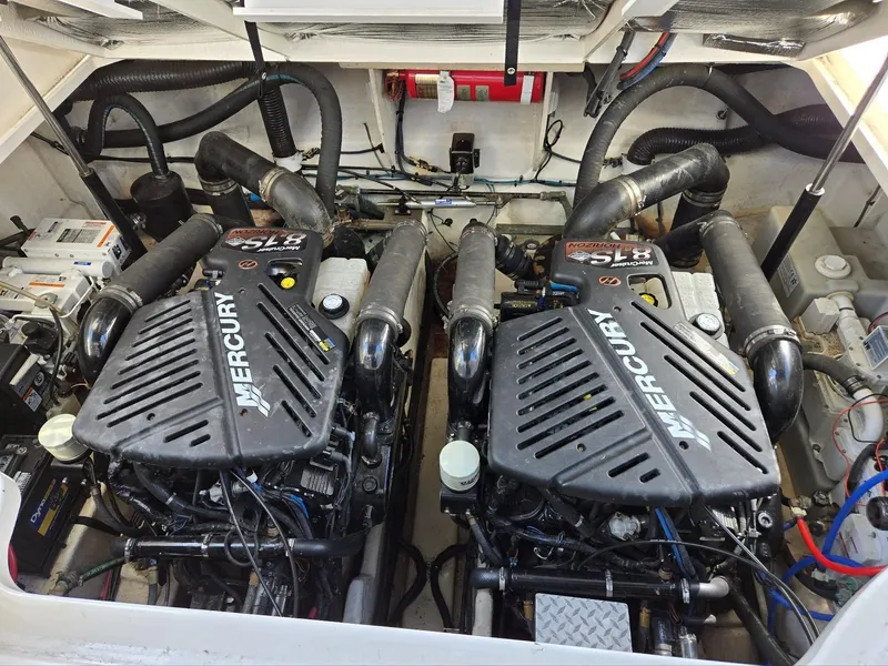 Slide: The Image of Engine compartment of a 2007 Sea Ray 340 Sundancer with twin Mercury engines. - 26