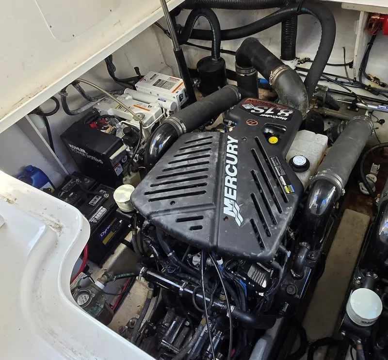 Slide: The Image of Engine compartment of 2007 Sea Ray 340 Sundancer with Mercury engine and batteries. - 27