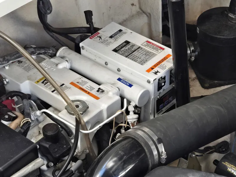 Slide: The Image of Engine compartment of 2007 Sea Ray 340 Sundancer with Kohler generator and wiring. - 29