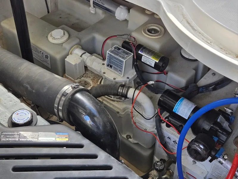 Slide: The Image of Engine compartment of a 2007 Sea Ray 340 Sundancer boat, showing mechanical components and wiring. - 31