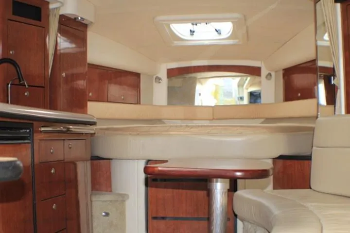 Slide: The Image of 2007 Sea Ray 340 Sundancer cabin interior with wood finish and seating area. - 35