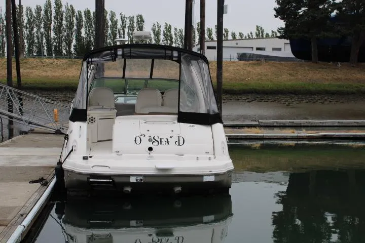 Slide: The Image of 2007 Sea Ray 340 Sundancer docked at marina, rear view with canopy. - 4