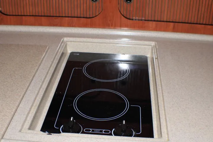 Slide: The Image of Built-in stovetop on 2007 Sea Ray 340 Sundancer yacht kitchen counter. - 43