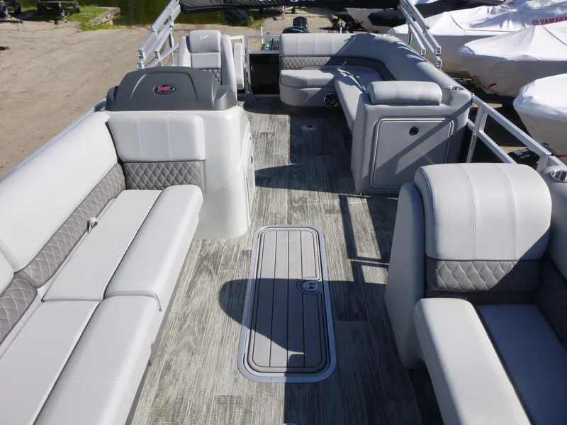 Slide: The Image of 2024 Ranger Reata 223C pontoon boat interior with luxurious seating and modern design. - 5