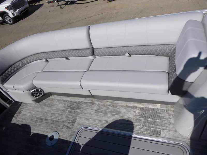 Slide: The Image of 2024 Ranger Reata 223C boat interior with luxurious gray seating and stylish flooring. - 9
