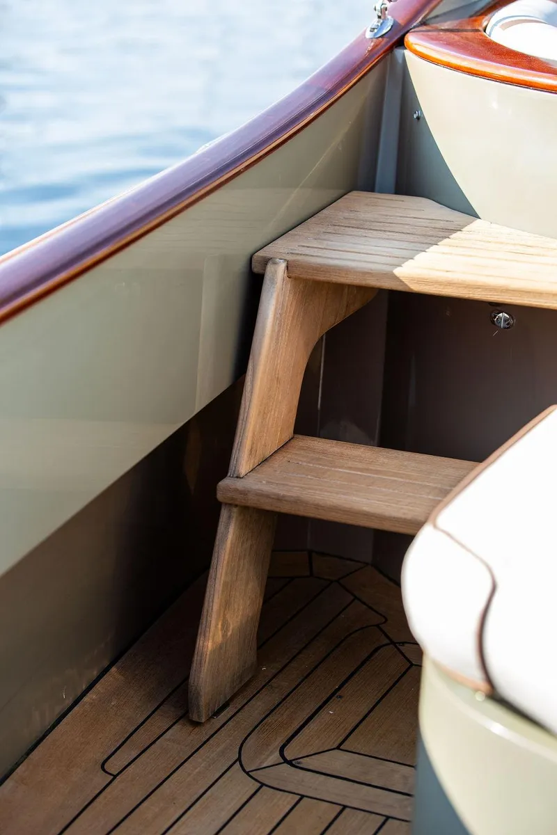 Slide: The Image of Wooden steps on a 2003 Hinckley Talaria 29R boat interior. - 36