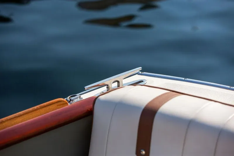 Slide: The Image of 2003 Hinckley Talaria 29R boat detail with leather seating and polished cleat. - 38