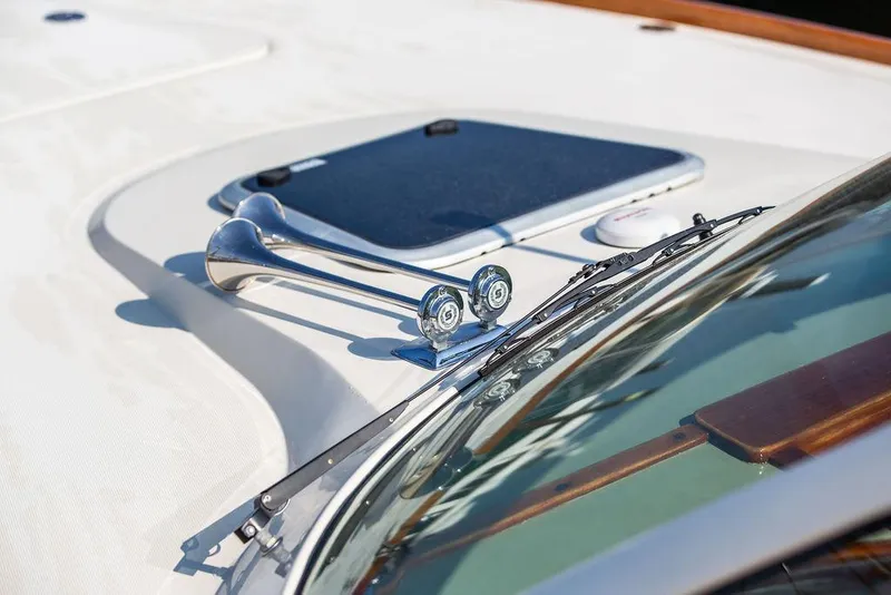Slide: The Image of Close-up of 2003 Hinckley Talaria 29R boat deck with chrome horns and windshield wipers. - 42