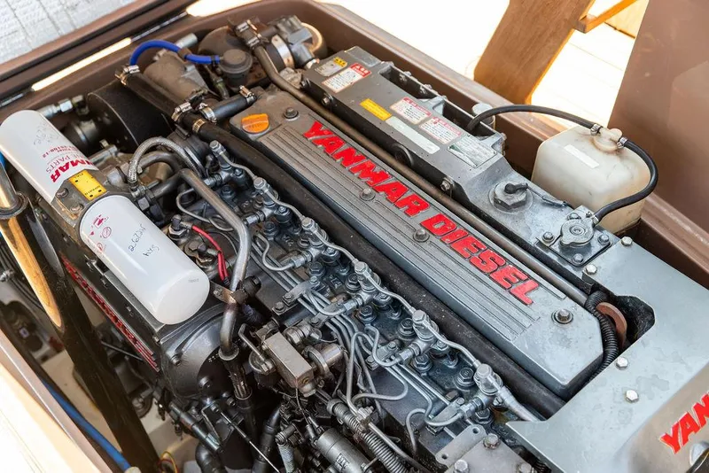 Slide: The Image of Yanmar diesel engine in a 2003 Hinckley Talaria 29R boat, showcasing intricate components. - 46