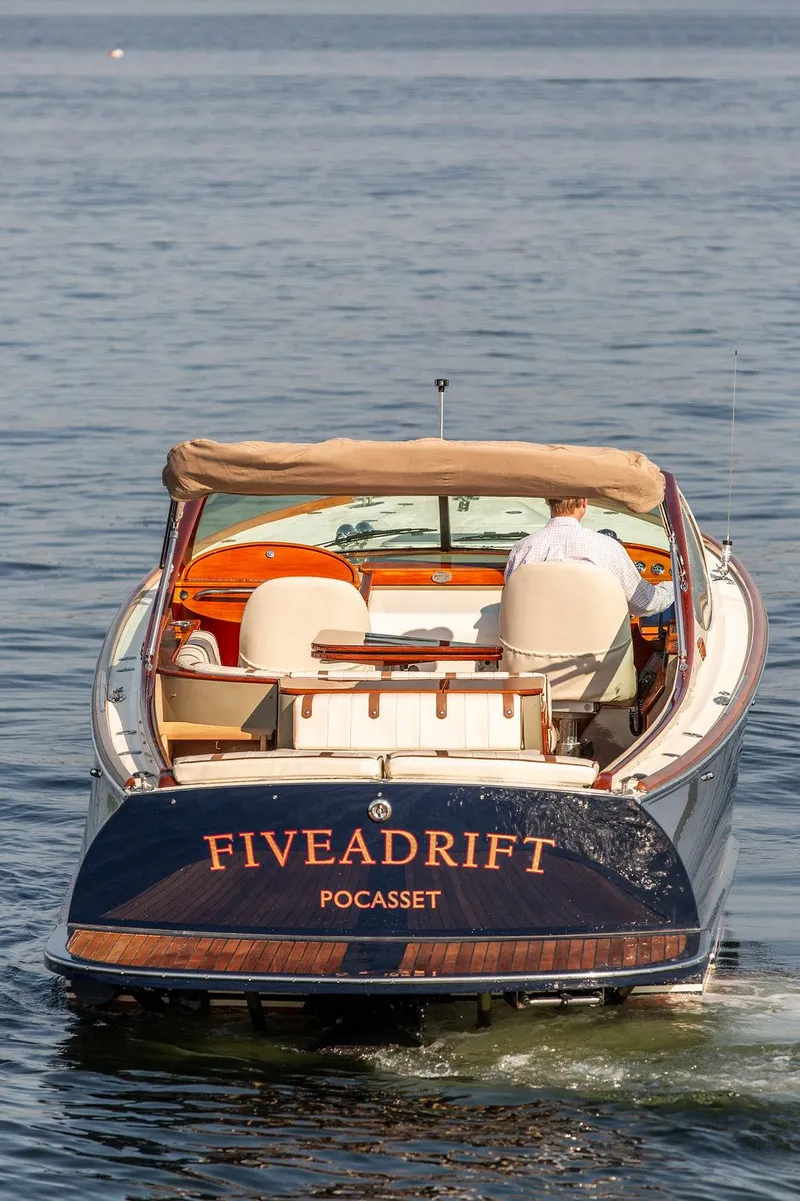 Slide: The Image of 2003 Hinckley Talaria 29R boat named "FIVEADRIFT" on calm water. - 12