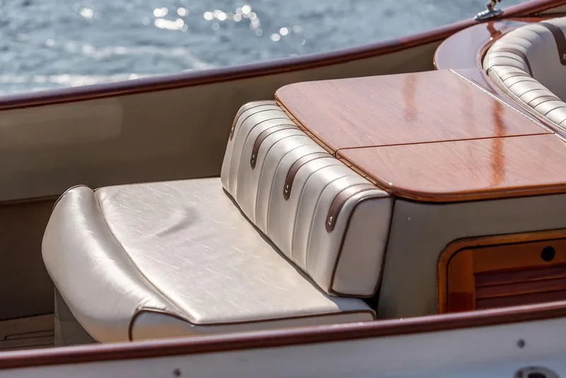 Slide: The Image of Luxurious seating on 2003 Hinckley Talaria 29R boat with elegant wood finish. - 21