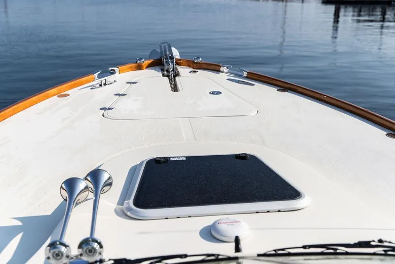 Slide: The Image of 2003 Hinckley Talaria 29R boat deck with chrome details and wooden trim. - 41