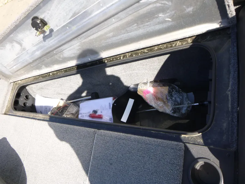 Slide: The Image of Open storage compartment in 2023 Tracker Pro Team 195 TXW Tournament Edition boat. - 11