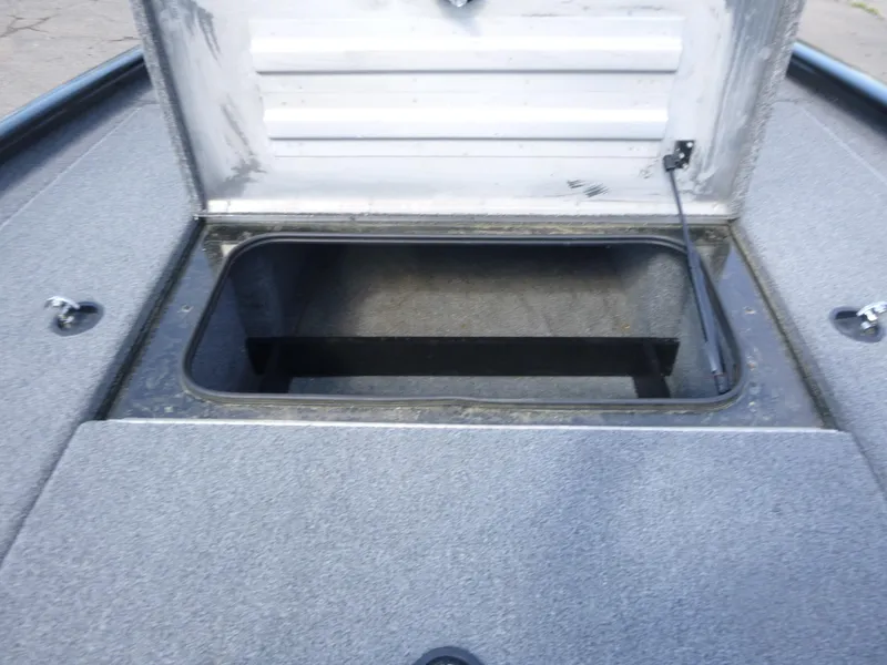 Slide: The Image of 2023 Tracker Pro Team 195 TXW Tournament Edition boat storage compartment open. - 12