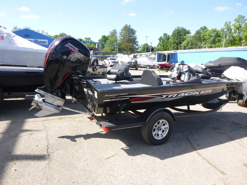 Slide: The Image of 2023 Tracker Pro Team 195 TXW Tournament Edition boat on trailer, outdoor display. - 3