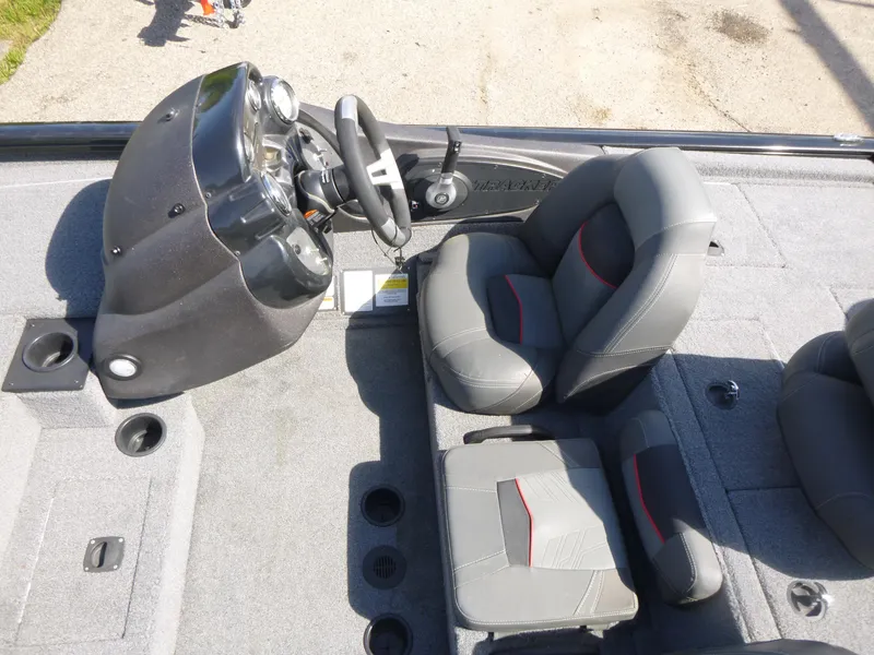 Slide: The Image of 2023 Tracker Pro Team 195 TXW Tournament Edition boat interior with steering console and seating. - 6