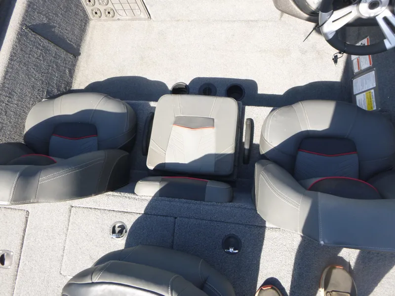 Slide: The Image of 2023 Tracker Pro Team 195 TXW Tournament Edition boat interior with gray seating and steering wheel. - 8