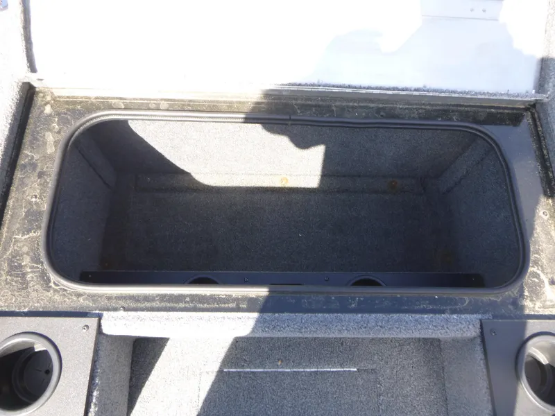 Slide: The Image of Open storage compartment in 2023 Tracker Pro Team 195 TXW Tournament Edition boat. - 9
