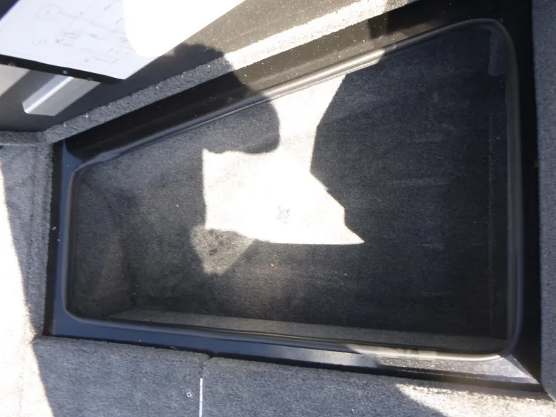 Slide: The Image of 2024 Ranger VS1682SC Angler storage compartment with carpeted interior. - 11