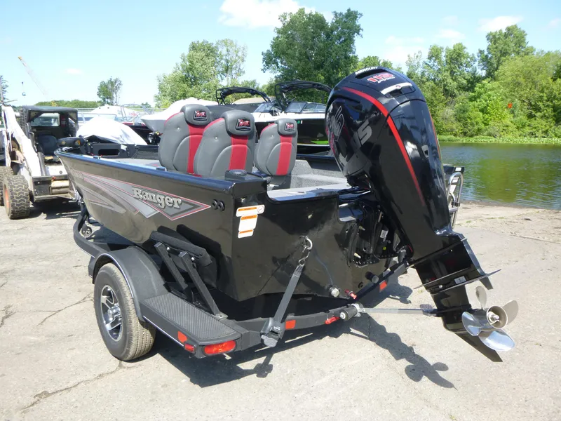 Slide: The Image of 2024 Ranger VS1682SC Angler boat with outboard motor, parked near a lake. - 3