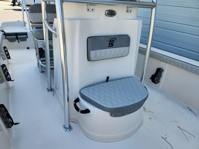 Slide: The Image of 2024 Carolina Skiff 23 LS boat interior with seating and storage features. - 8