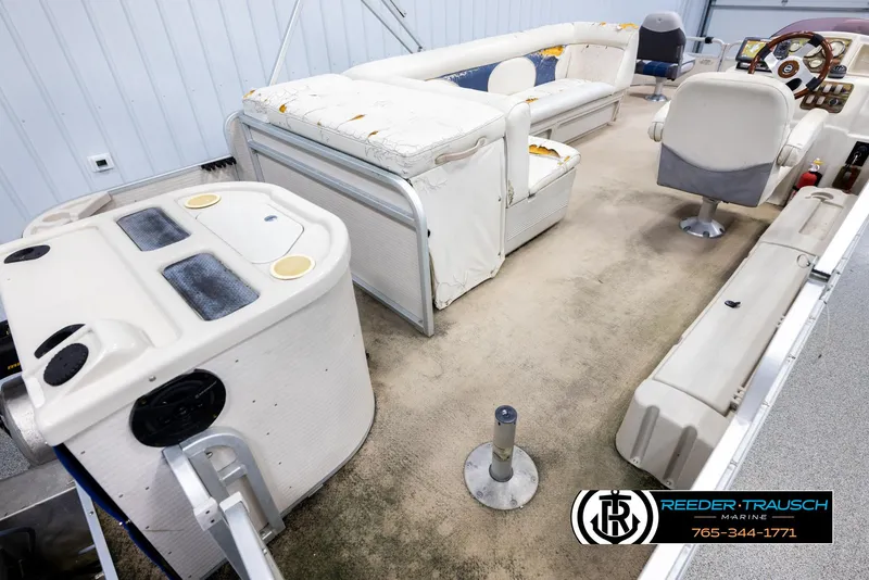 Slide: The Image of Interior of a 2007 Premier 2223 Navigator boat with seating and control panel. - 12
