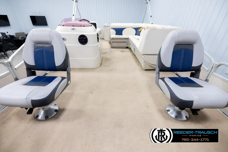 Slide: The Image of Interior of a 2007 Premier 2223 Navigator boat with seating and control console. - 13