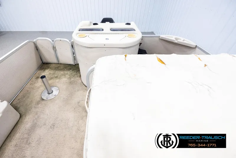 Slide: The Image of 2007 Premier 2223 Navigator boat interior with worn seating and carpet. - 15