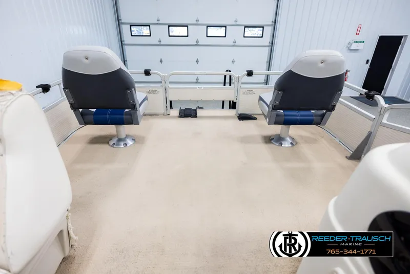 Slide: The Image of Interior of a 2007 Premier 2223 Navigator boat with two swivel seats. - 18