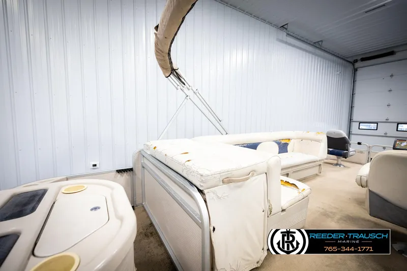 Slide: The Image of 2007 Premier 2223 Navigator pontoon boat interior in storage facility. - 19