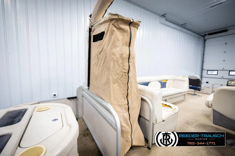 Slide: The Image of 2007 Premier 2223 Navigator pontoon boat interior with seating and storage. - 20