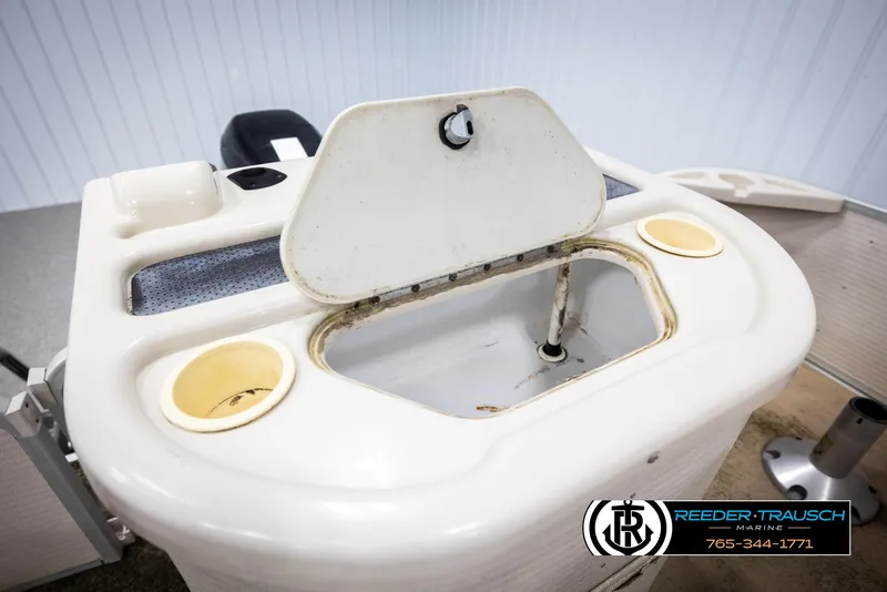 Slide: The Image of Open storage compartment on a 2007 Premier 2223 Navigator boat. - 22