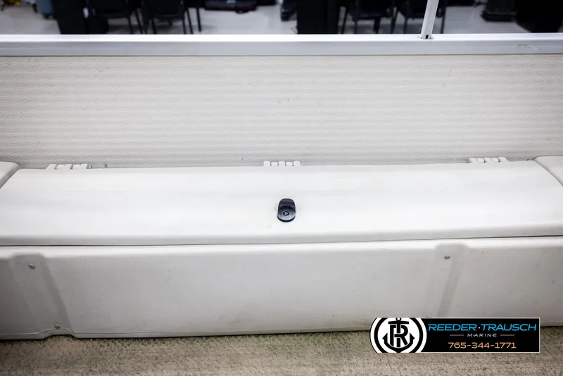 Slide: The Image of 2007 Premier 2223 Navigator boat seat with Reeder-Trausch Marine logo and contact number. - 25