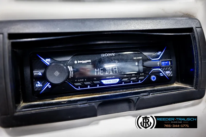 Slide: The Image of Sony stereo system in a 2007 Premier 2223 Navigator boat dashboard. - 32