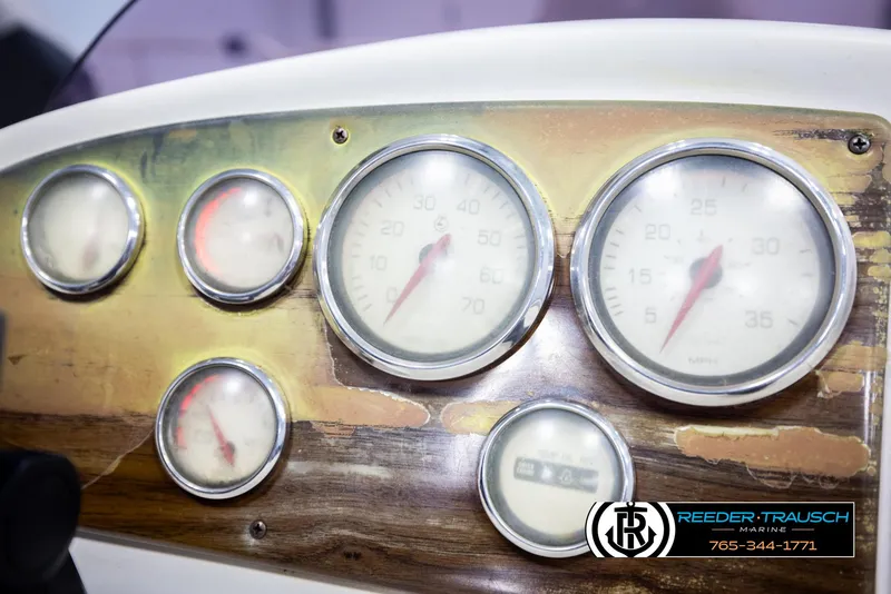 Slide: The Image of Dashboard of a 2007 Premier 2223 Navigator boat with multiple gauges. - 34