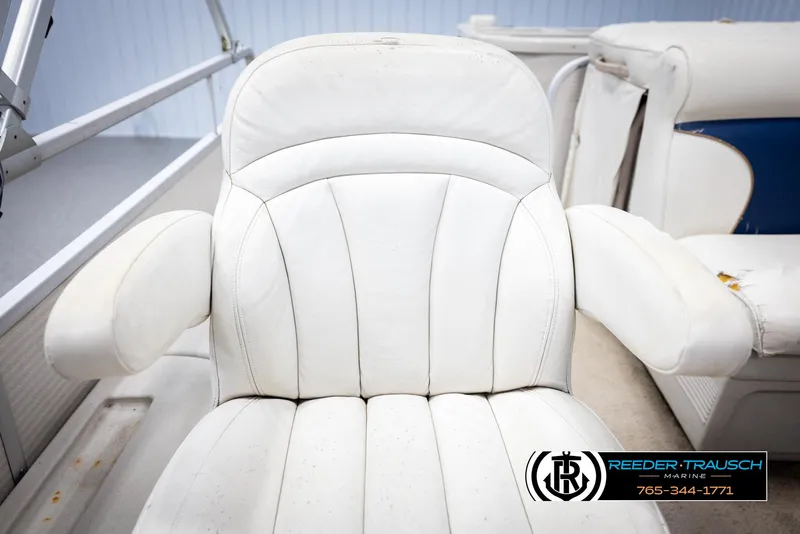 Slide: The Image of White captain's chair on 2007 Premier 2223 Navigator boat, Reeder-Trausch Marine logo visible. - 40
