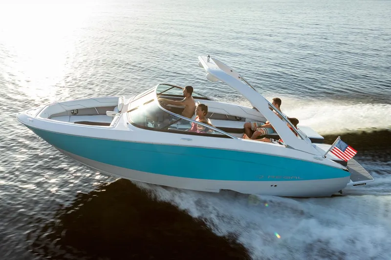 Slide: The Image of Manufacturer Provided Image: 2020 Regal LS4 Surf boat cruising on water with passengers. - 20