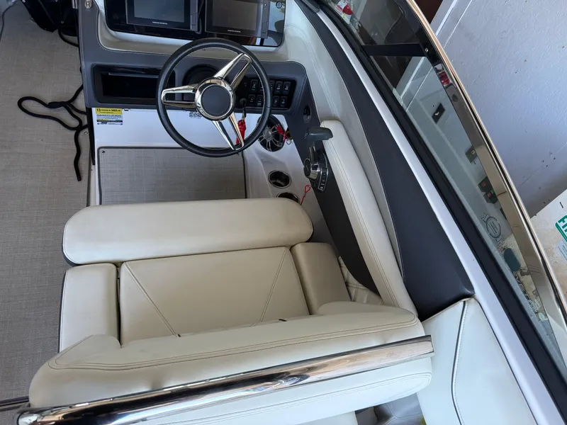 Slide: The Image of 2020 Regal LS4 Surf boat interior with steering wheel and dashboard controls. - 8