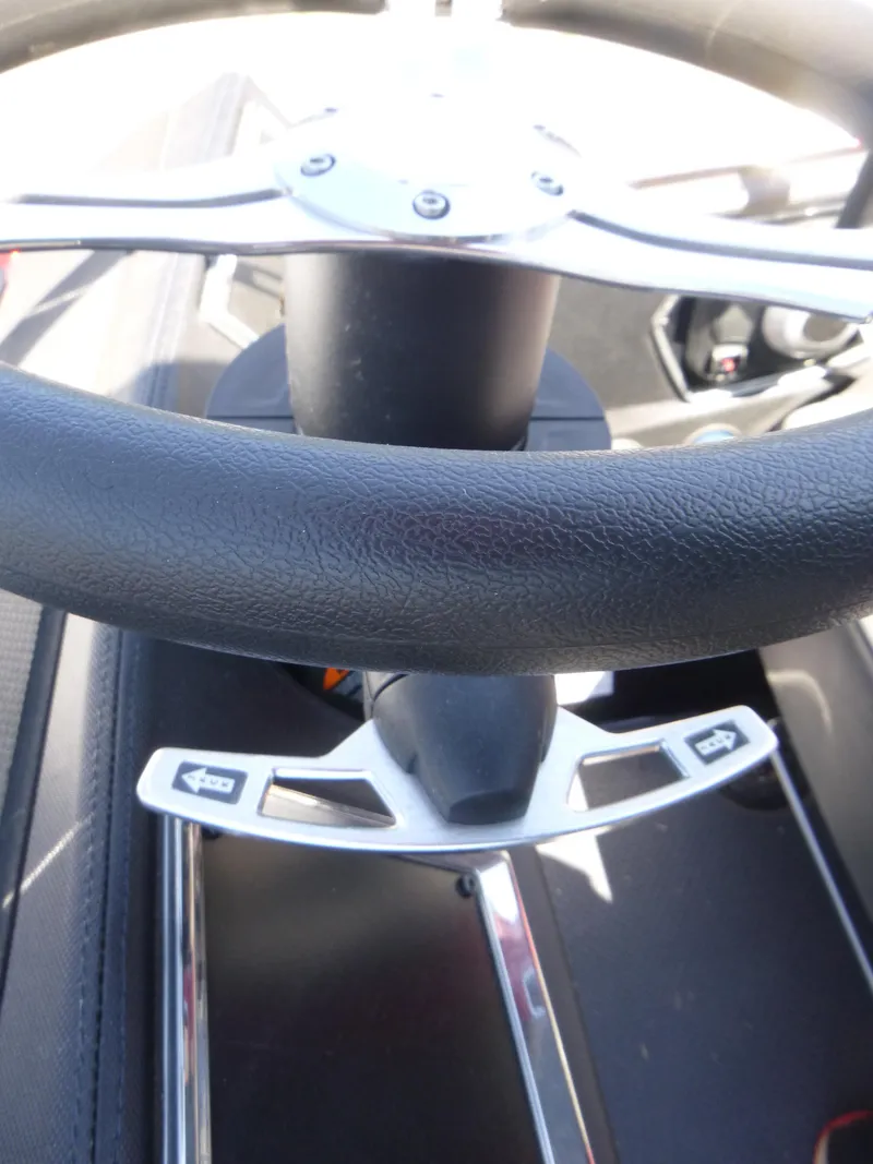 Slide: The Image of 2024 Ranger Z521R steering wheel, close-up view, showcasing modern design and controls. - 11