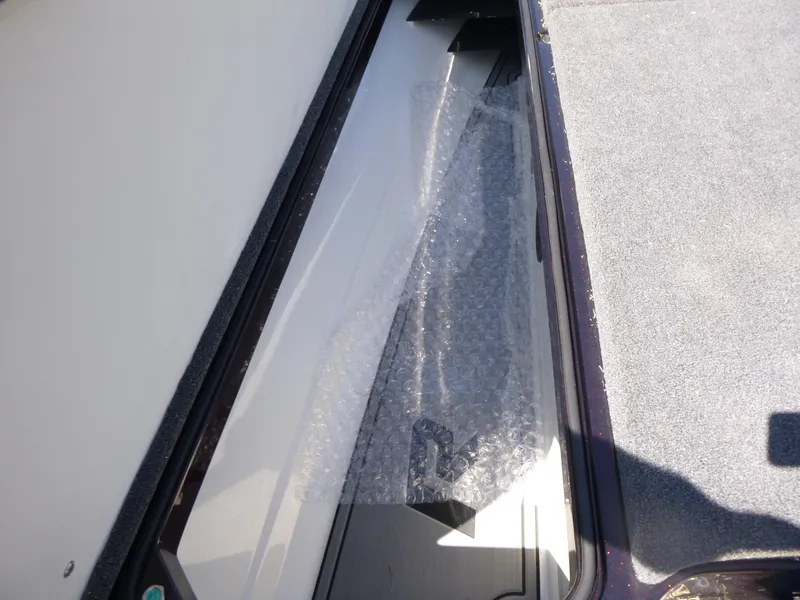 Slide: The Image of 2024 Ranger Z521R storage compartment with bubble wrap, showcasing interior design. - 15