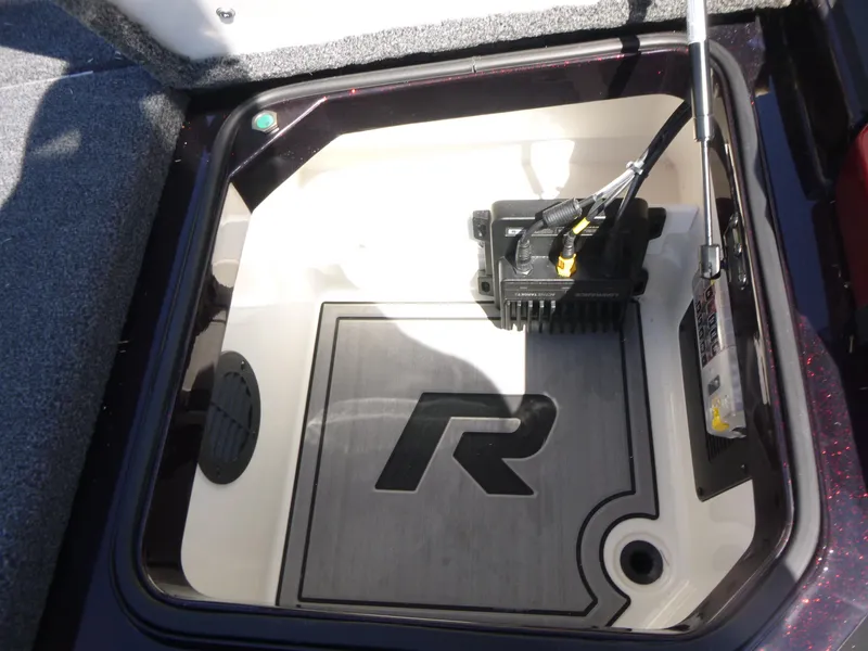 Slide: The Image of 2024 Ranger Z521R Ranger Cup Equipped storage compartment with electronic components. - 17