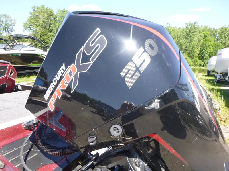 Slide: The Image of 2024 Ranger Z521R with Mercury Pro XS 250 engine, parked outdoors. - 21