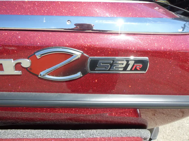 Slide: The Image of 2024 Ranger Z521R Ranger Cup Equipped, red metallic finish, close-up of model emblem. - 22