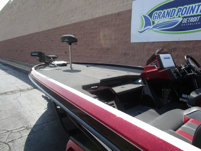 Slide: The Image of 2024 Ranger Z521R Ranger Cup Equipped boat, red and black, at Grand Pointe Marina. - 23