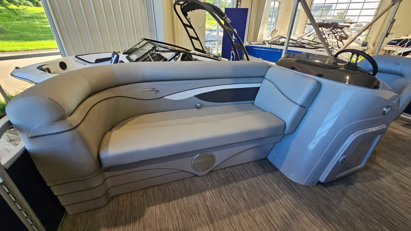 Slide: The Image of 2020 Bennington 188 SV pontoon boat interior with gray seating and helm. - 11