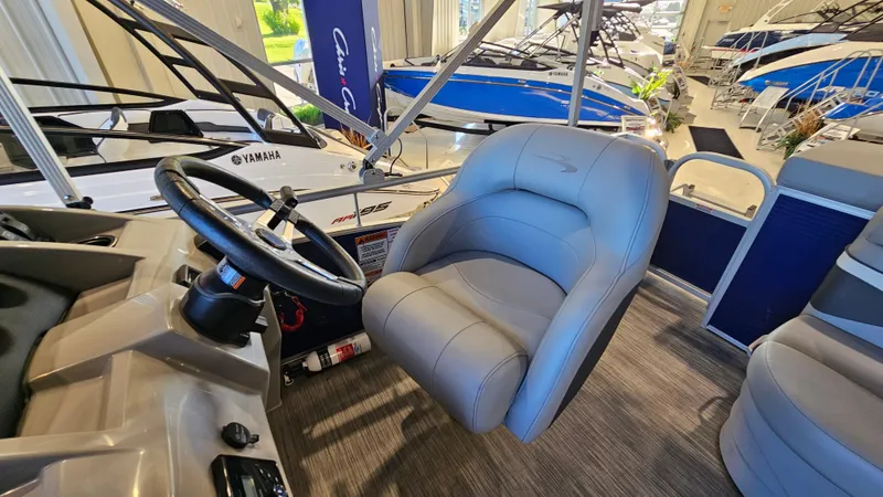 Slide: The Image of 2020 Bennington 188 SV boat interior with steering wheel and plush seating. - 13