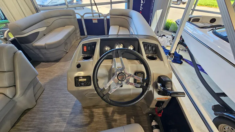 Slide: The Image of Interior view of a 2020 Bennington 188 SV pontoon boat with steering console. - 14