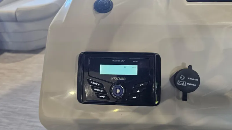 Slide: The Image of Audio system controls on 2020 Bennington 188 SV boat dashboard. - 16