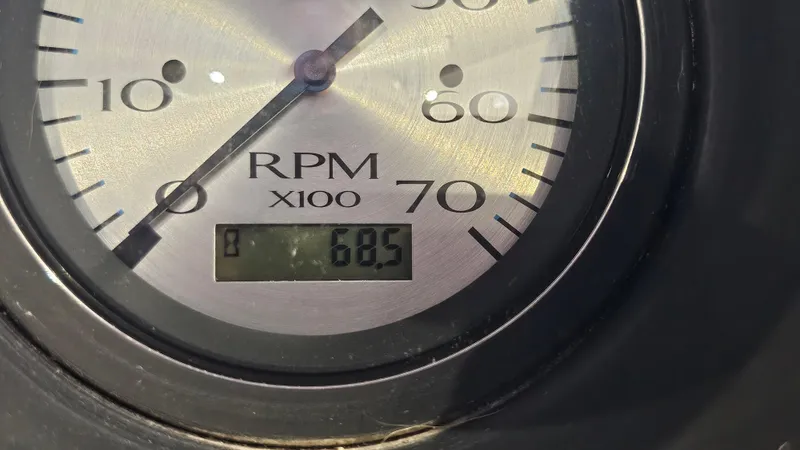 Slide: The Image of Close-up of a 2020 Bennington 188 SV tachometer showing 605 RPM. - 17