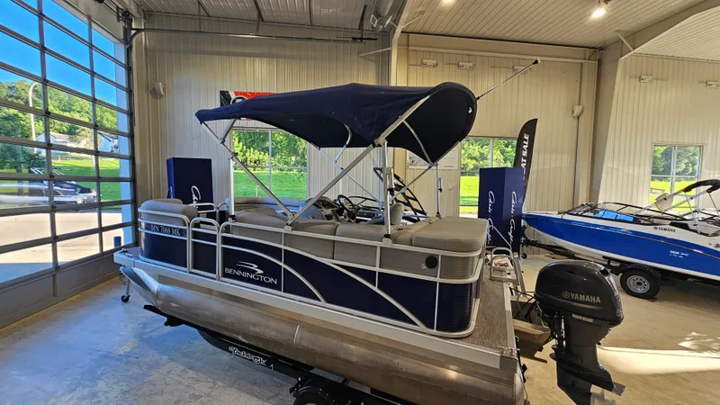 Slide: The Image of 2020 Bennington 188 SV pontoon boat with Yamaha motor in showroom. - 3